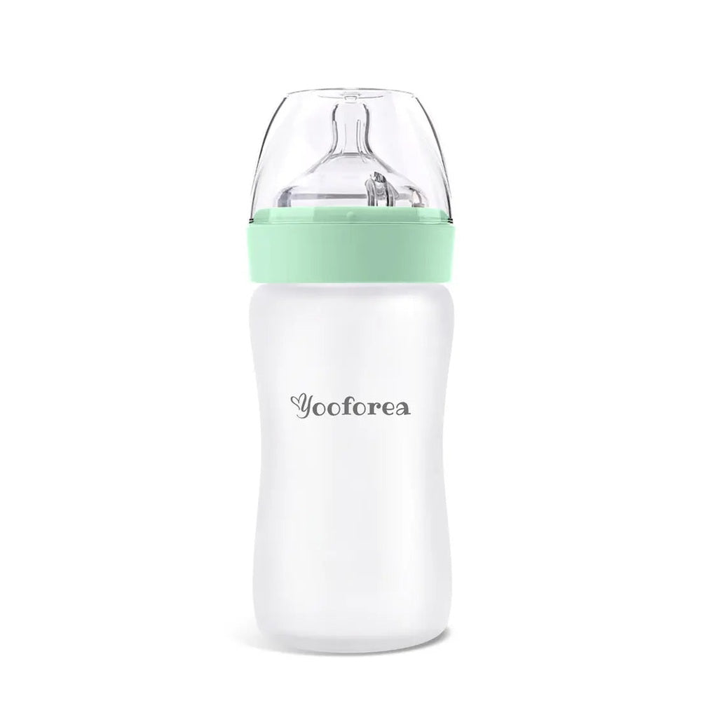 Yooforea Silicone Coated Glass Baby Bottle 9Oz/270Ml with mint green collar shown upright for easy feeding