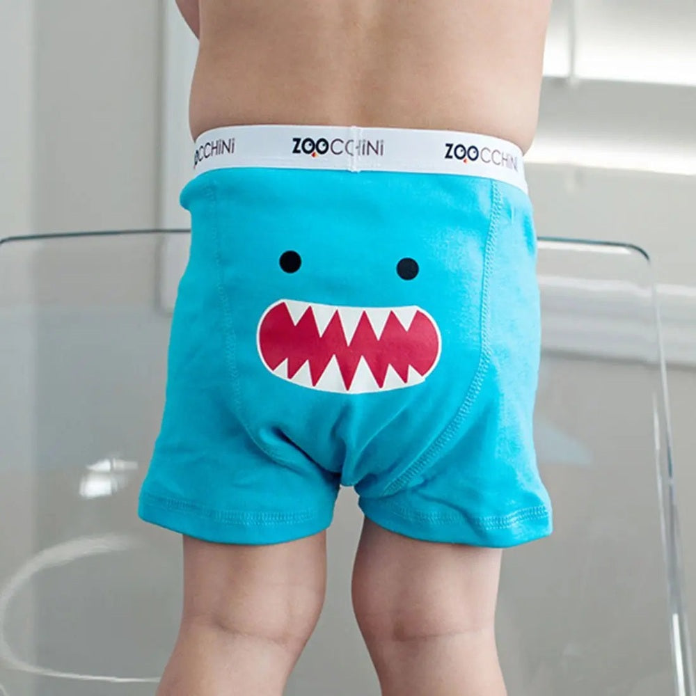 Zoocchini Boys Organic Boxer 3Pk Monster Mash blue shorts with white waistband and red monster mouth graphic, worn by a child.